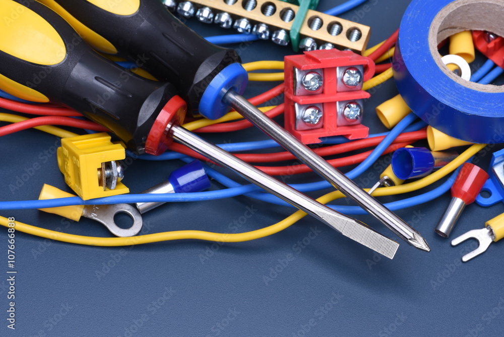 Electrical component kit to use in electrical installations on blue metal background Electrical component kit to use in electrical installations on blue metal background