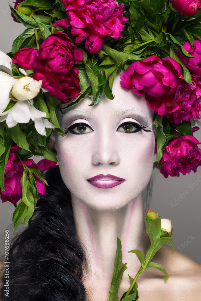 Beautiful woman with make-up and flowers