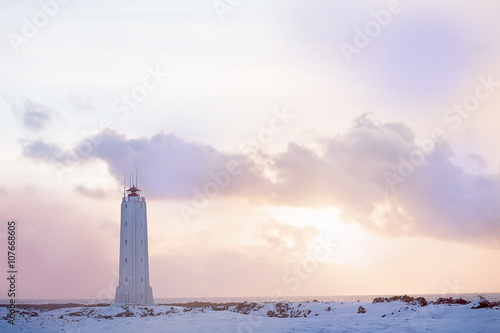 Beacon on the coast of the Atlantic Ocean in Iceland at sunset in the winter