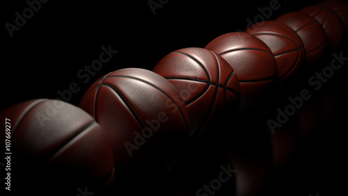 Basketballs on black backgrounds.