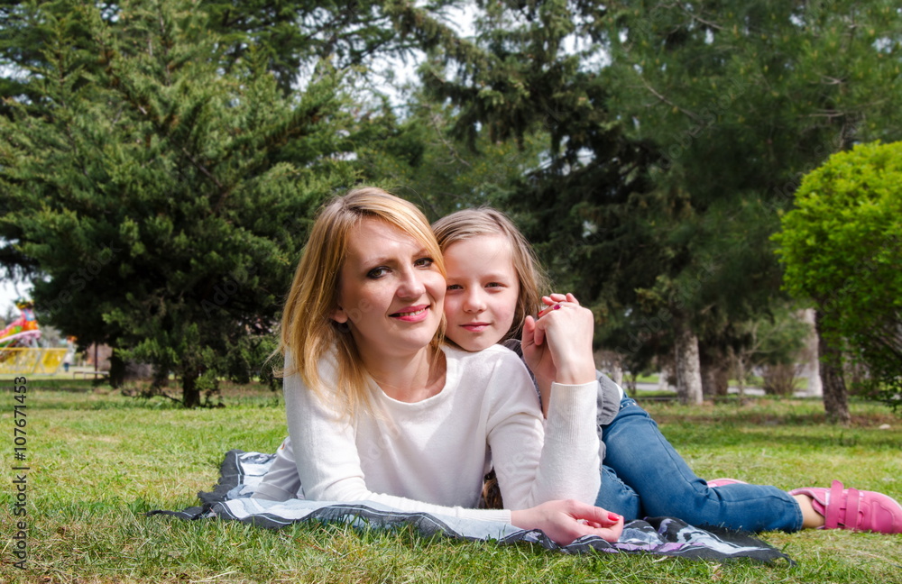 Fototapeta premium mother with daughter having fun in park