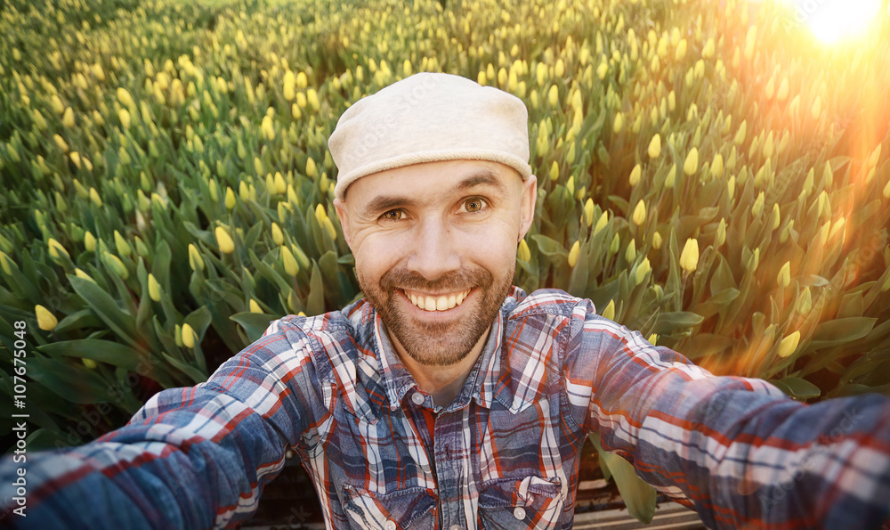 selfie man happy spring tulips field bouquet selfie man happy spring tulips field bouquet