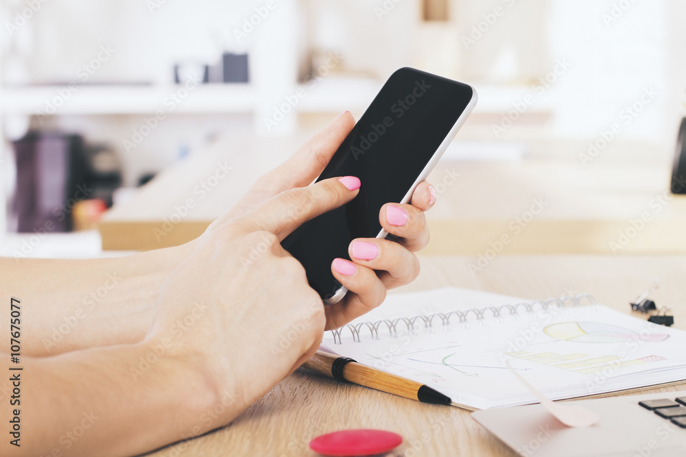 Fototapeta premium Female pointing at phone