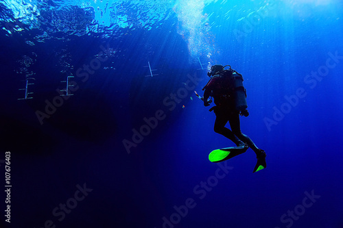 unusual photo diver underwater background