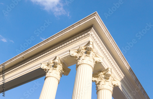 roman poles with blue sky, exterior building