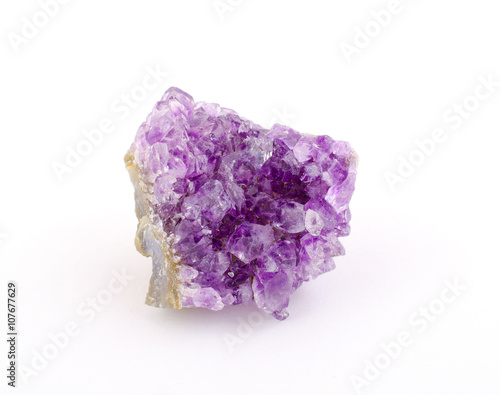 Purple amethyst stone isolated on white (as rough amethyst crystals)