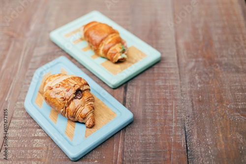 Two boards with croissants
