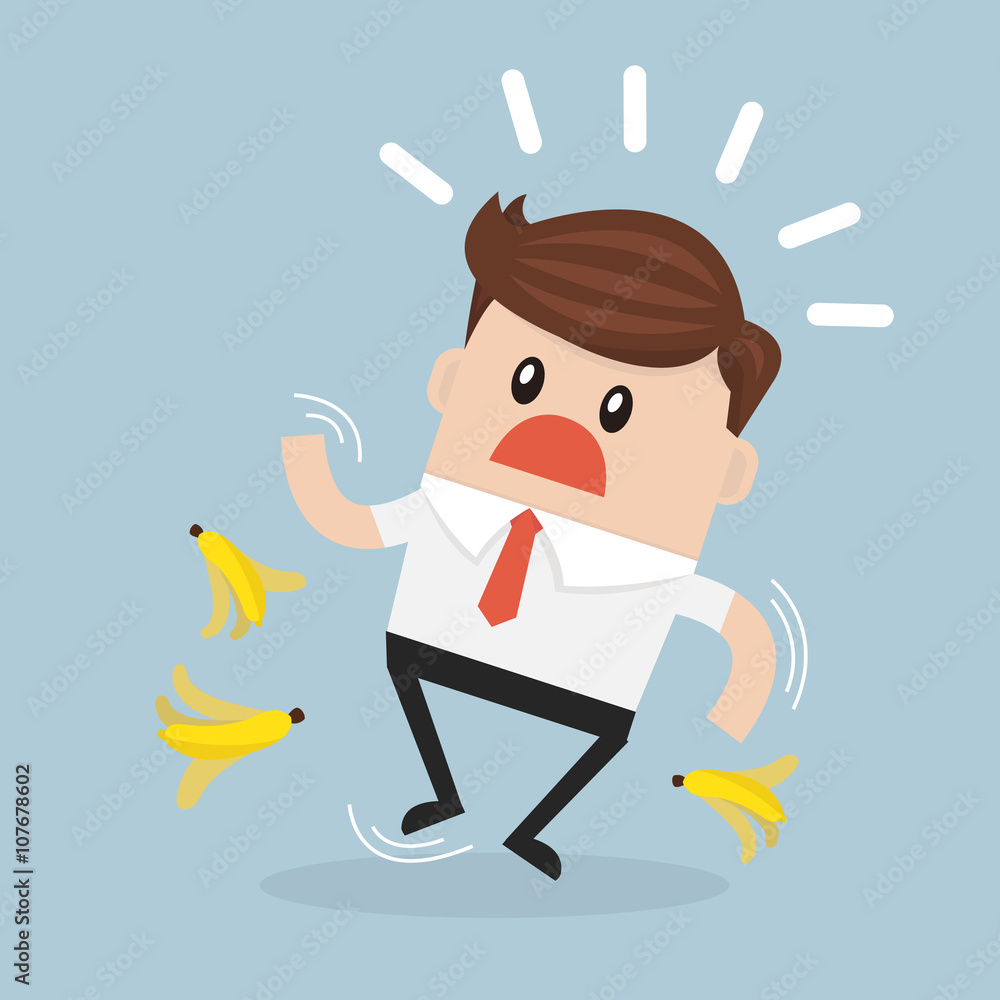 Businessman slipping on a banana peel. Businessman slipping on a banana peel.