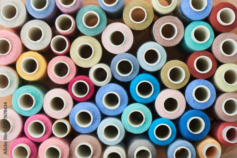 Set of colored sewing thread spools Set of colored sewing thread spools