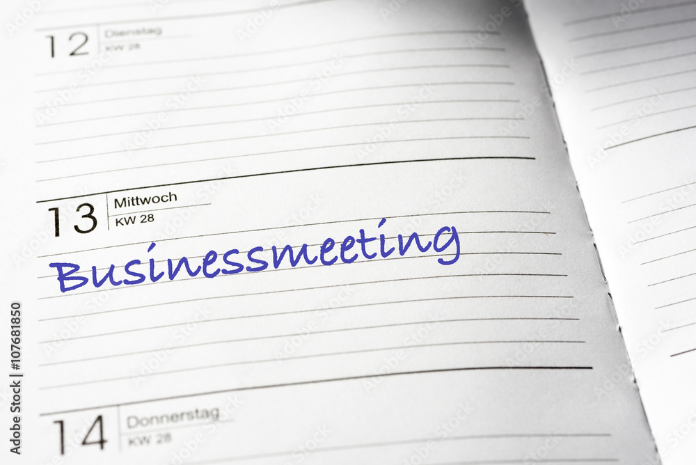 Terminkalender mit Eintrag Businessmeeting Terminkalender mit Eintrag Businessmeeting