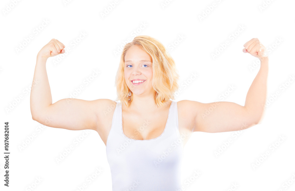 Fototapeta premium Young girl showing her muscles