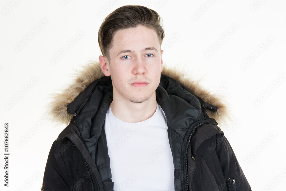 Young handsome man in coat looking at the camera Young handsome man in coat looking at the camera