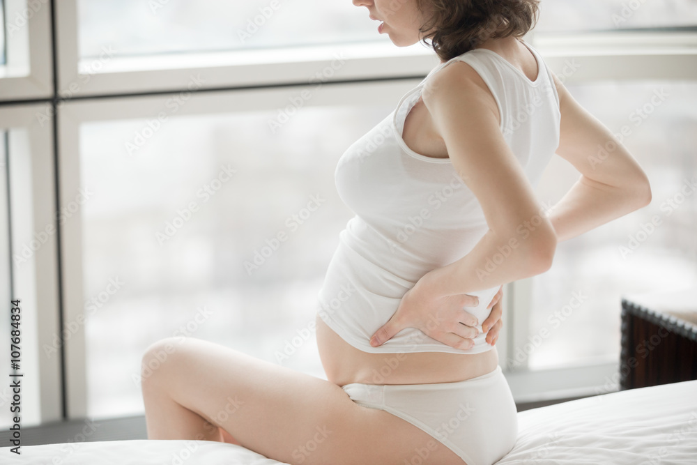 Pregnant woman having back pain Pregnant woman having back pain