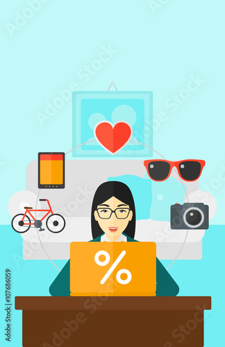 Woman shopping online using her laptop.