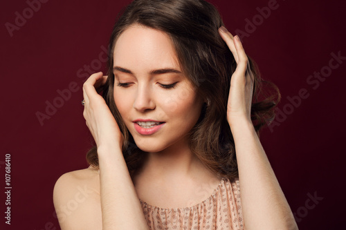 Romantic Beauty Portrait. Healthy wavy brown hair and perfect ho