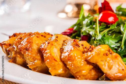 Chicken breast and salad with mixed greens