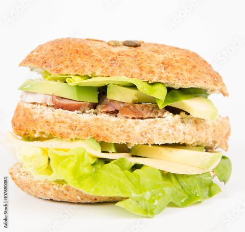Sandwich with cheese, avocado, sirloin and lettuce