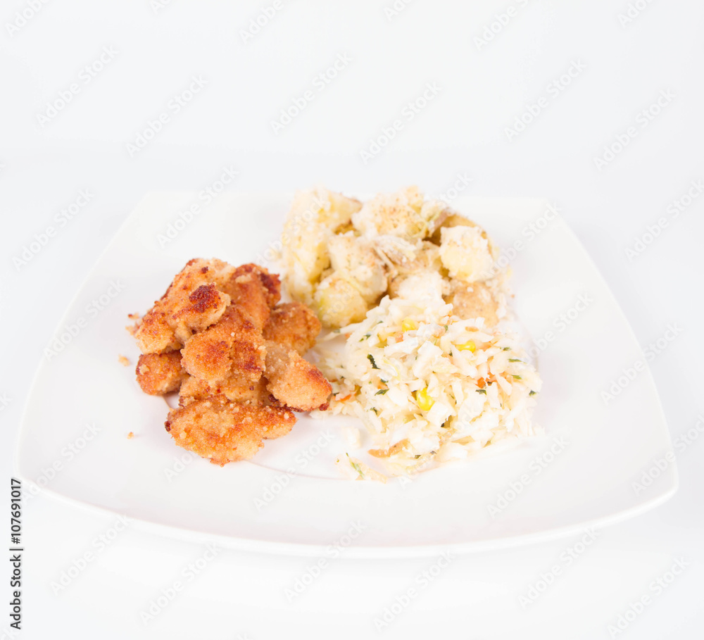 Deep fried chicken, potatoes and salad