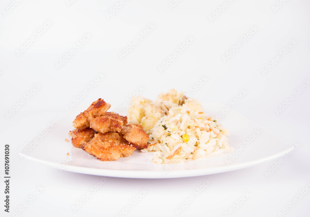 Deep fried chicken, potatoes and salad Deep fried chicken, potatoes and salad