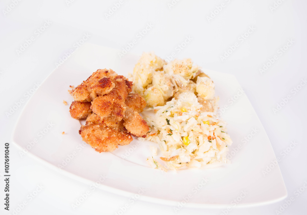 Deep fried chicken, potatoes and salad