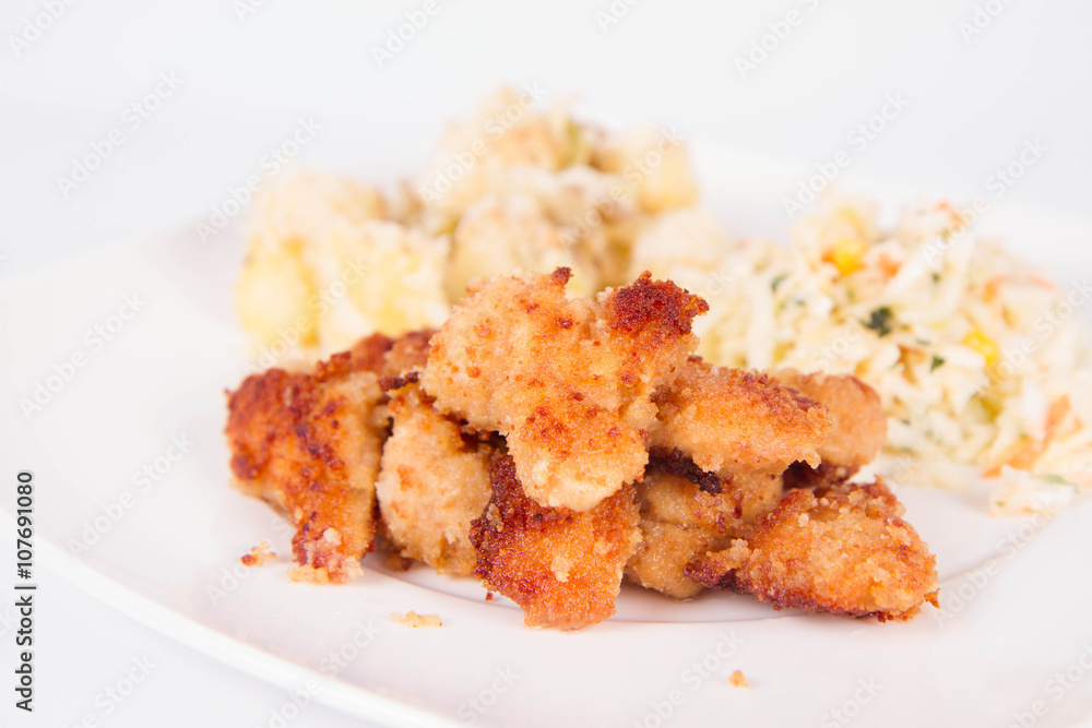 Deep fried chicken, potatoes and salad Deep fried chicken, potatoes and salad