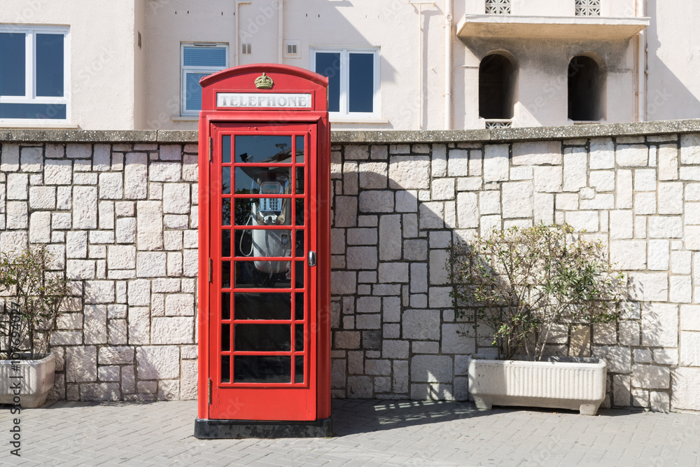 Obraz premium Phone booth. Typical British telephone booth at the street.