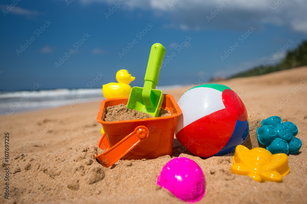 Beach toys in the sand at the beach Beach toys in the sand at the beach