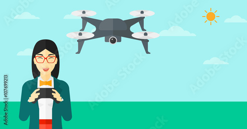 Woman flying drone.