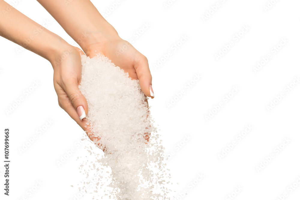 Sea salt crystals in women hand
