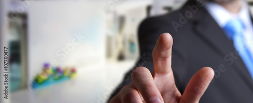 Young man on office background