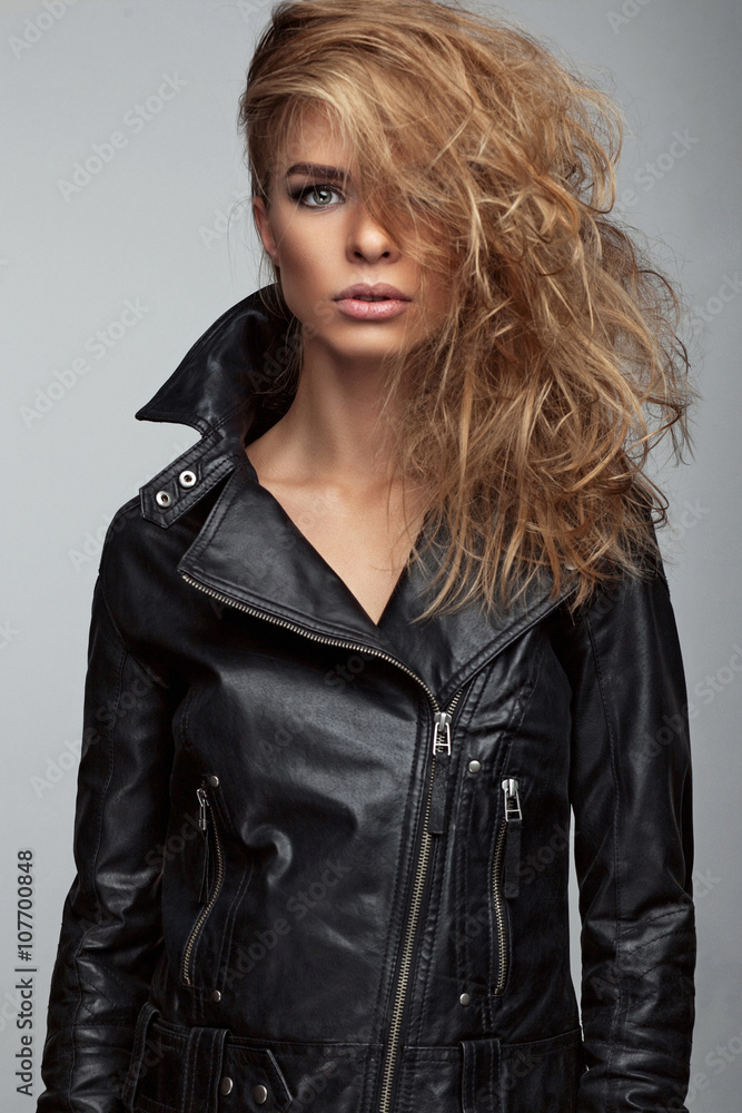 Fashion shoot of girl with beautiful hair style in a leather jacket