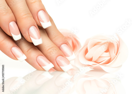 Fotobehang Woman hands with french manicure  close-up
