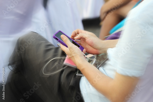 blurred people use smartphone