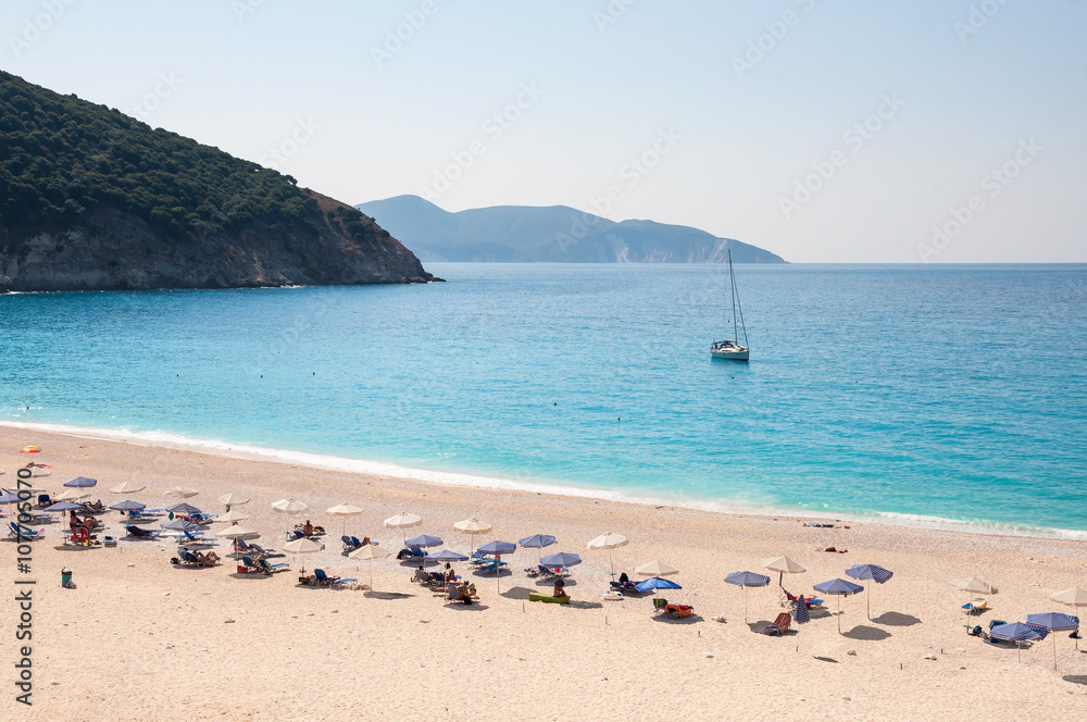 Sunbeds and umbrellas on the Myrtos beach