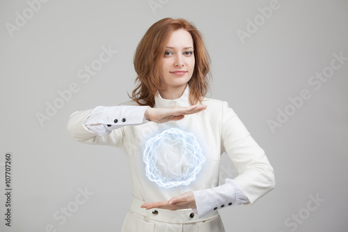 Woman with glowing magical energy ball. photo