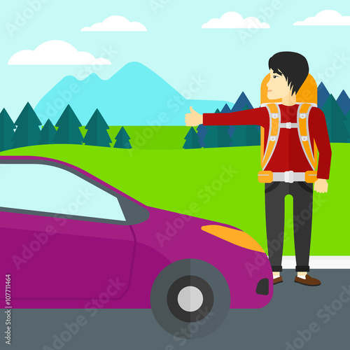 Young man hitchhiking.