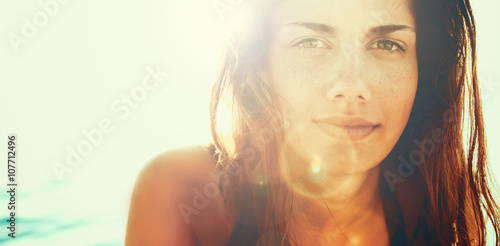 Face of young woman in summer sun