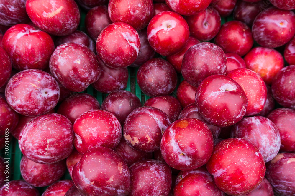 Ripe Plums Background. Fresh ripe red plums Ripe Plums Background. Fresh ripe red plums