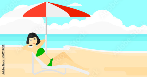 Woman sitting in chaise longue.