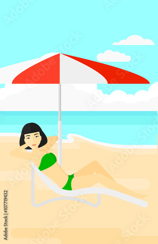 Woman sitting in chaise longue.