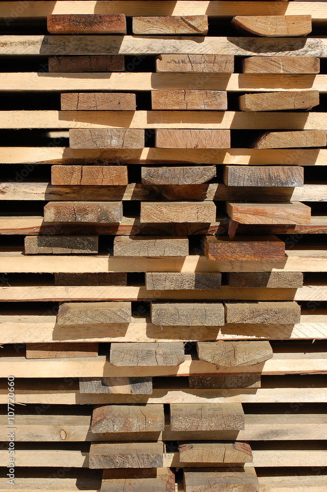 The ends of the boards at a construction site in the stack