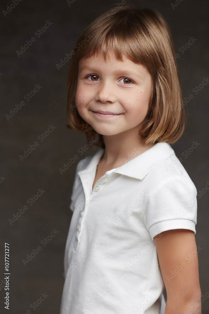 Portrait of cute little girl in a white shirt. Portrait of cute little girl in a white shirt.