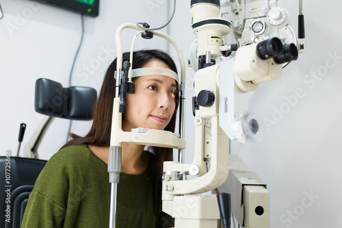 Patient during an eye examination in eye clinic