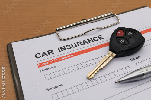 motor insurance with car key and pen