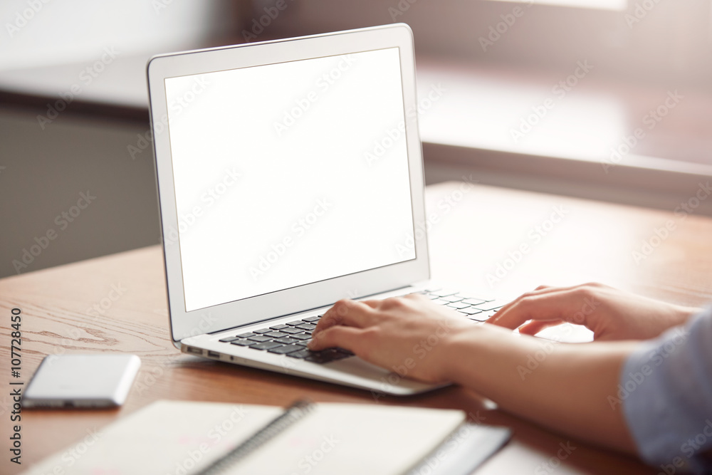 Close-up of a female keyboarding on laptop with copy space screen while sitting in caf?. Cropped view of a young attractive woman working on computer during working day in office Close-up of a female keyboarding on laptop with copy space screen while sitting in caf?. Cropped view of a young attractive woman working on computer during working day in office