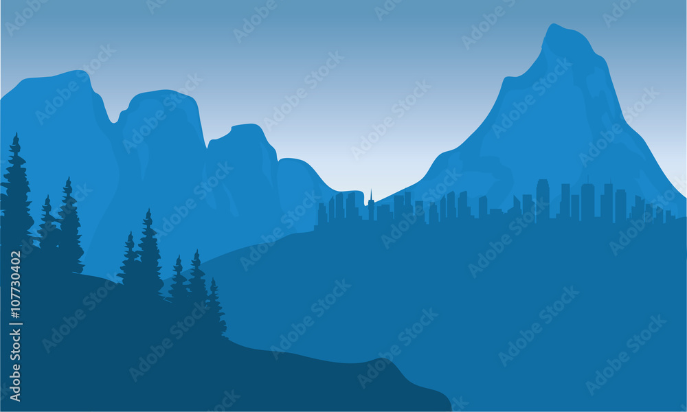 silhouette of city on mountain