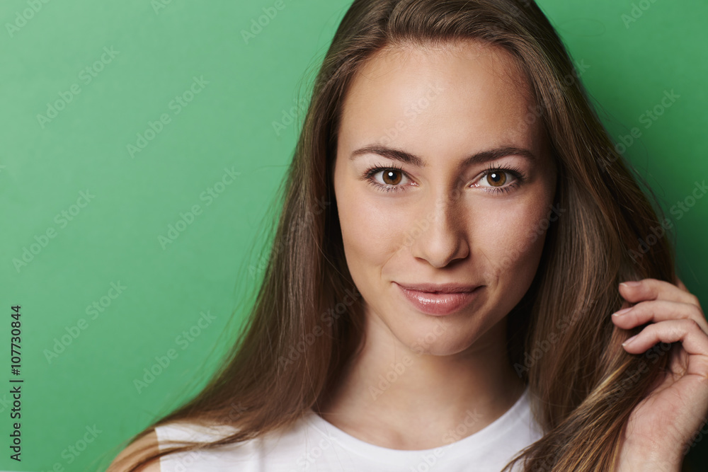 Gorgeous young woman against green background, portrait Gorgeous young woman against green background, portrait