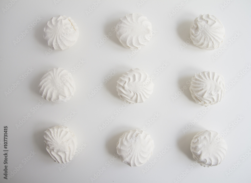 Top view of Latvian marshmallovs - zefiri on white background Top view of Latvian marshmallovs - zefiri on white background
