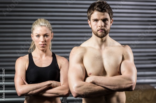 Serious crossfit couple posing 