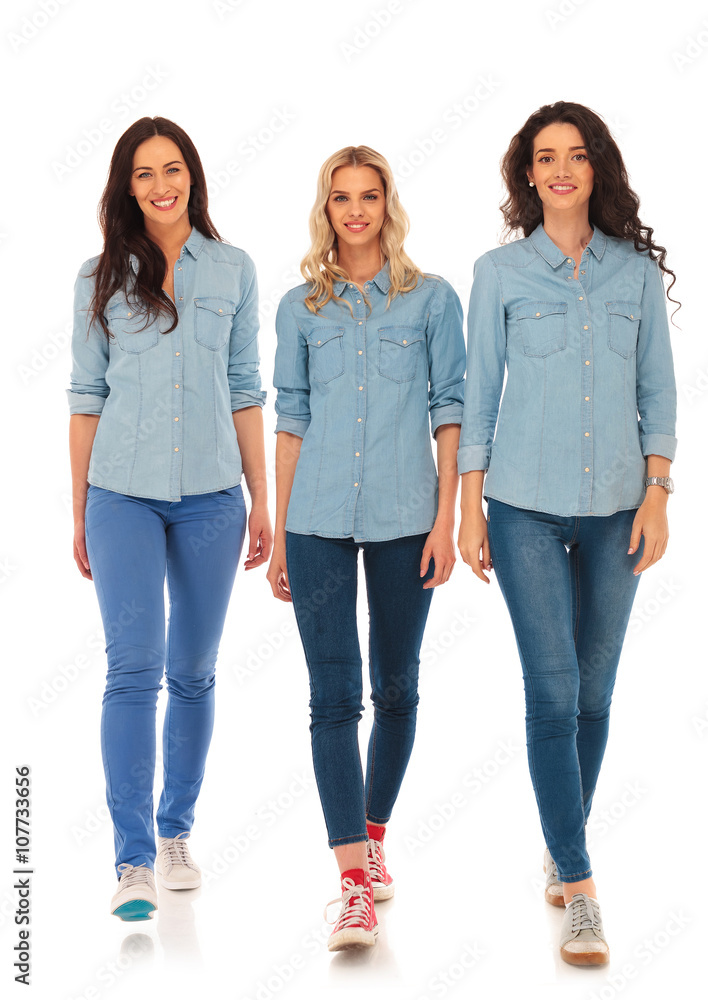 3 happy casual women walking forward and smile 3 happy casual women walking forward and smile